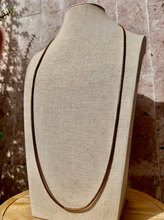 Collar largo de hematita dorada
